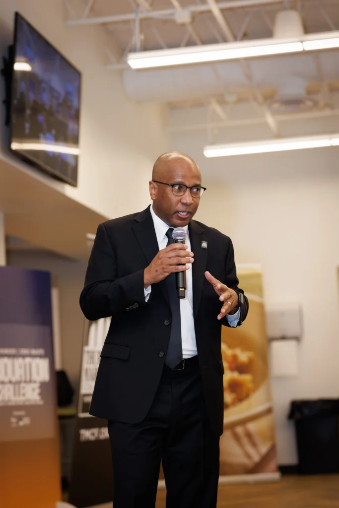 Speaker presenting at HBCU event holding microphone