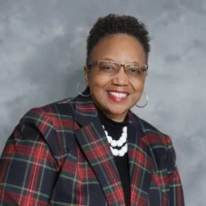 Professional headshot of Dr. Manicia J. Finch in plaid blazer