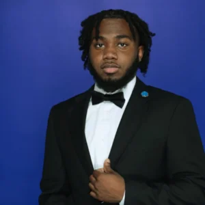 Professional headshot of Jayquahn Blackledge in formal attire with bow tie