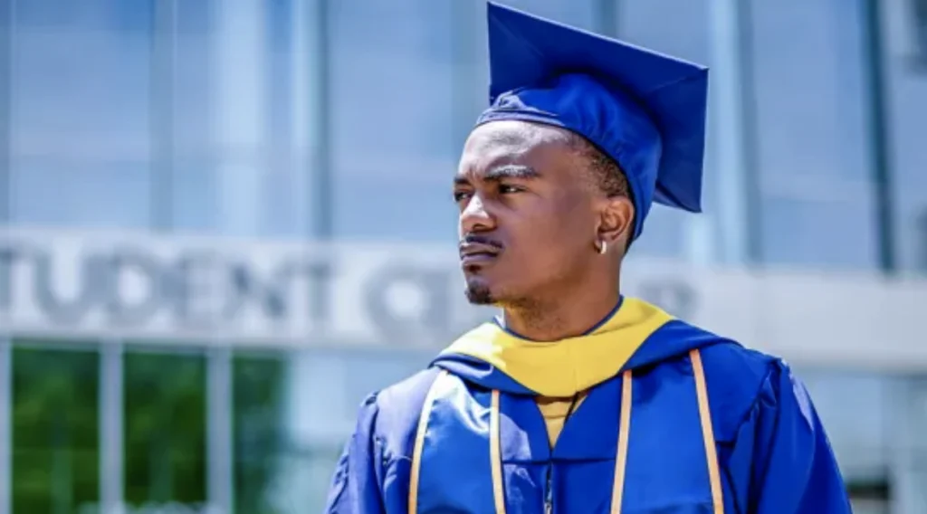 Graduate in blue cap and gown at HBCU commencement ceremony